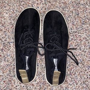 Black Steve Madden sneakers with gold back strap
